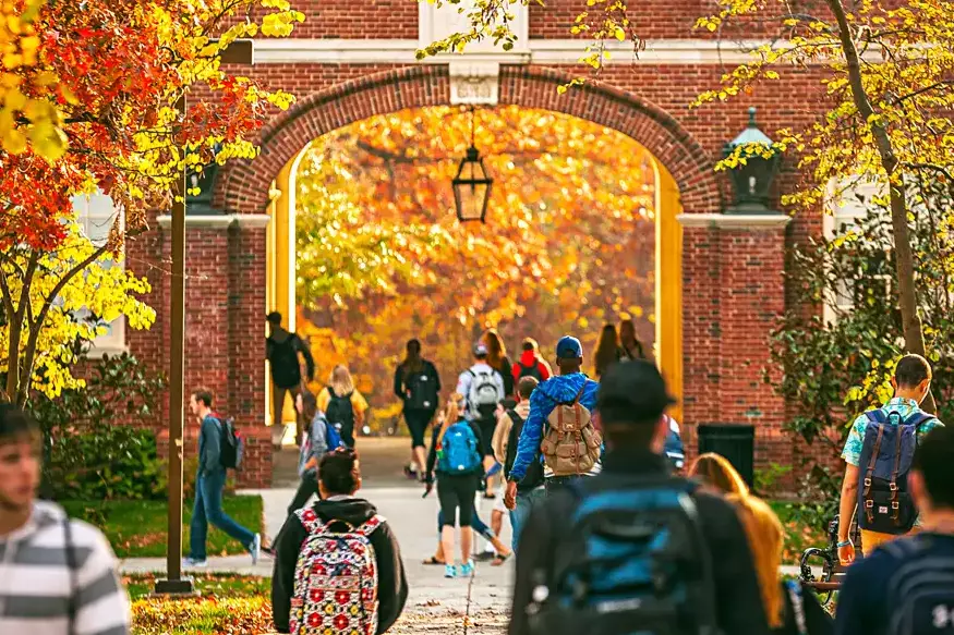An archway where students are walking through.